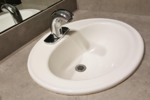 A white basin in a bathroom